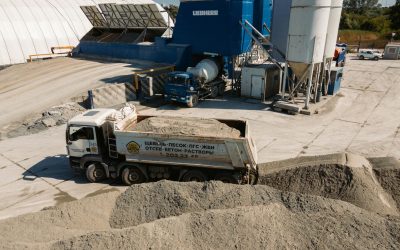 Aerial view of a concrete batching plant with dump truck in Novosibirsk, Russia.